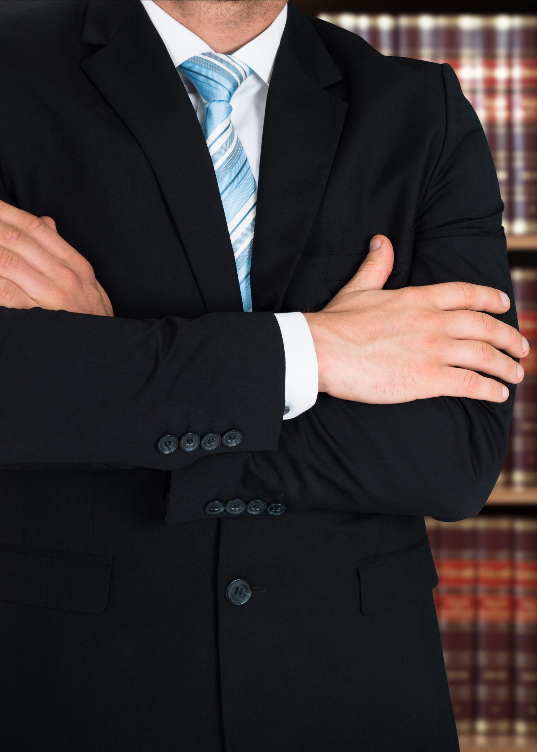 Midsection Of Lawyer With Arms Crossed